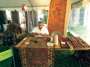 David Zahirpour repairs the wear at the Textile Museum